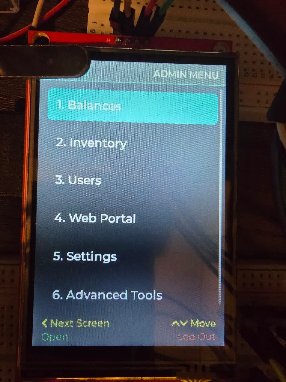 Admin menu on the device showing six categories: Balances, Inventory, Users, Web Portal, Settings, Advanced Tools