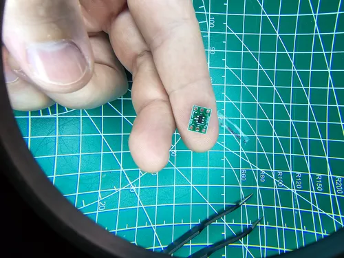 ATtiny10 chip soldered onto a small breakout adapter board