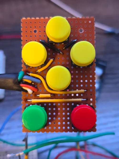 Front of the six-button color-coded tactile input array