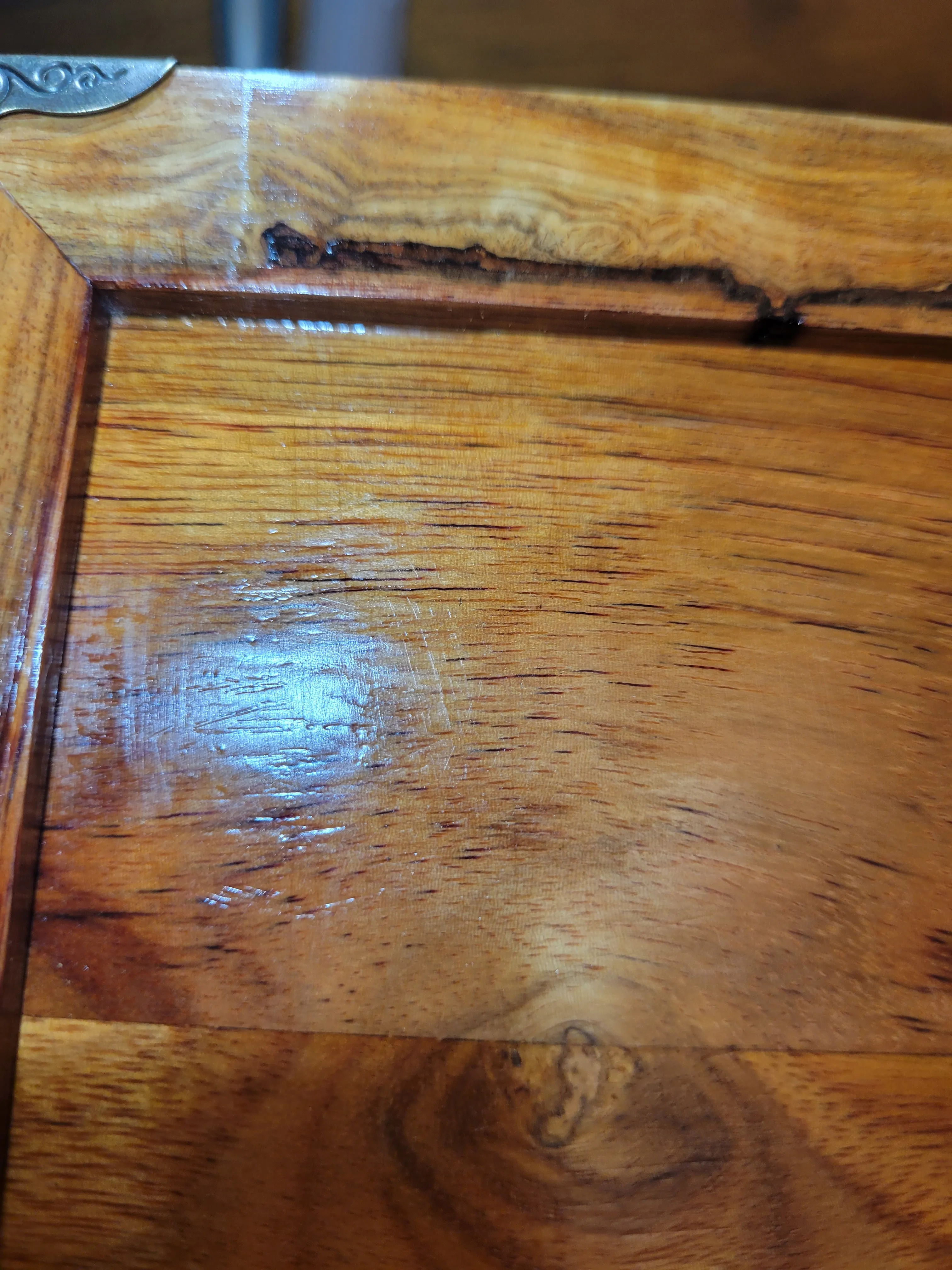 Close-up of scratches left in the polyurethane finish