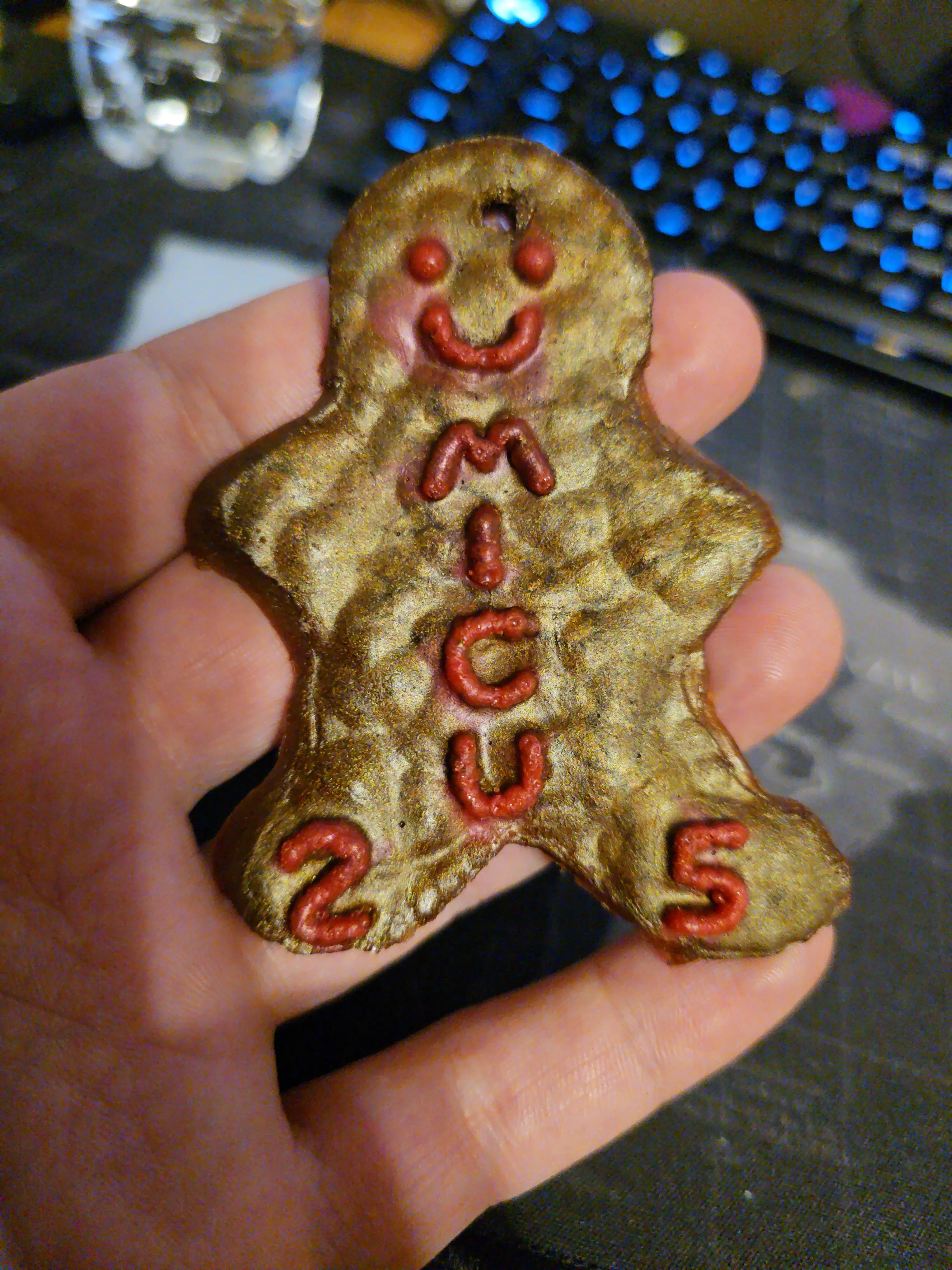 First attempt gingerbread ornament cast from an air-dry clay master, showing a rough porous texture