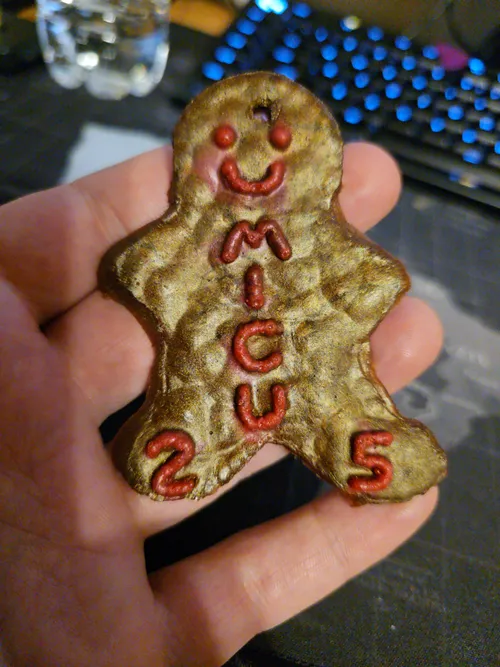 First attempt gingerbread ornament cast from an air-dry clay master, showing a rough porous texture
