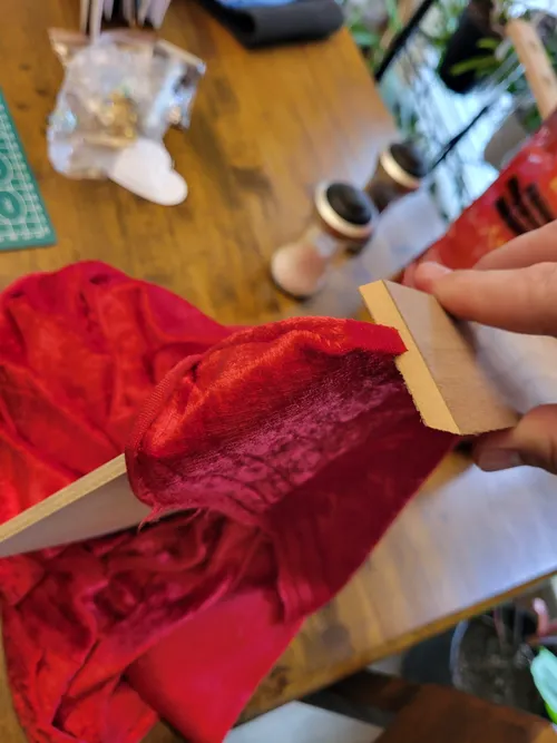 Test-fitting the velvet bottom against a scrap piece